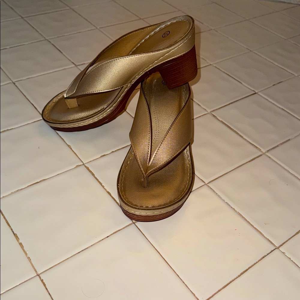 Brand new metallic gold sandals, size7 with a 2 inch heel.